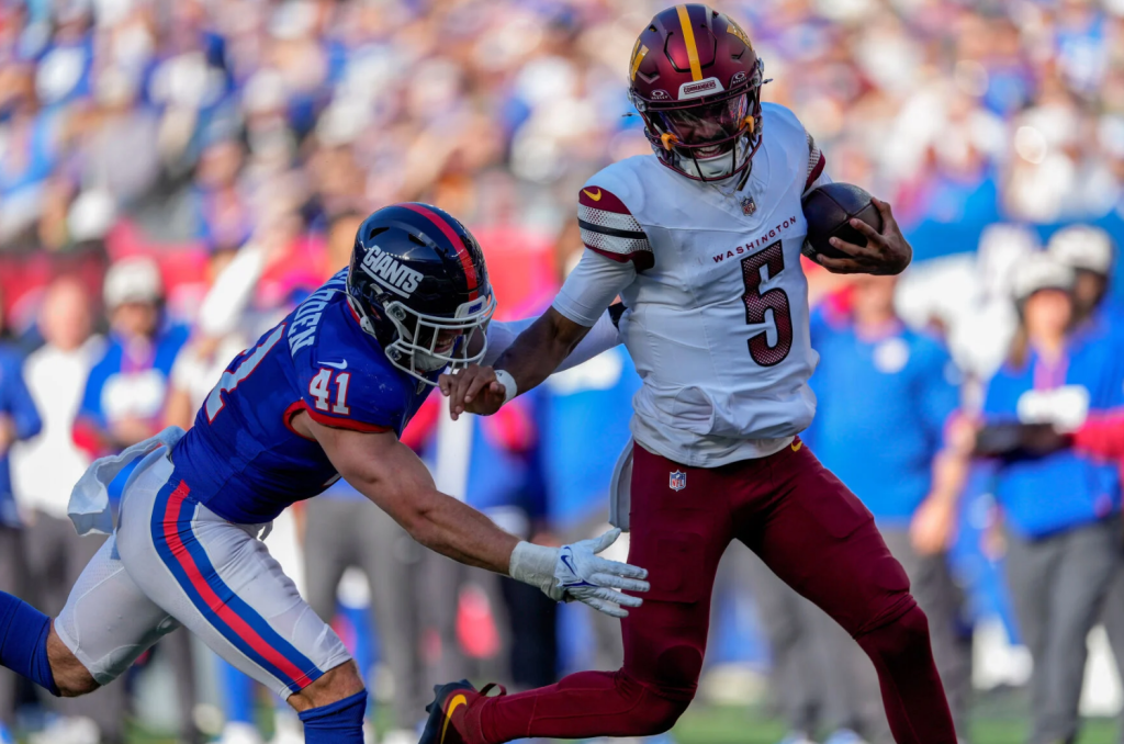 Commanders quarterback Jayden Daniels (5) carries the ball against Giants linebacker Micah McFadden last season.

Photo via AP Photo